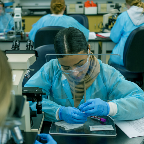 UNH student working in a science lab